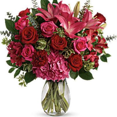 <div class="m-pdp-tabs-description">
<div id="mark-2" class="m-pdp-tabs-marketing-description">A luxurious bouquet that's sure to leave your special someone absolutely love struck! There's no denying the dramatic beauty of these radiant, red hot roses, hydrangea and lilies.</div>
</div>
<p id="arrngDescp">This luxe arrangement includes pink hydrangea, hot pink roses, red roses, dark pink asiatic lilies, dark pink alstroemeria, maroon carnations, pitta negra, spiral eucalyptus, and lemon leaf. Delivered in a glass jordan vase.</p>