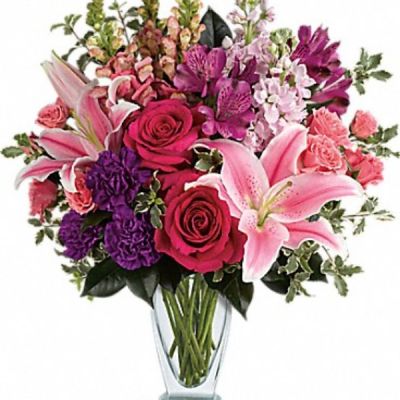 <div class="m-pdp-tabs-description">
<div id="mark-3" class="m-pdp-tabs-marketing-description">Hand-delivered in a shapely glass vase, this sumptuous arrangement of roses and lilies is a lavish way to celebrate a special day - or surprise someone just because!</div>
</div>
<p id="arrngDescp">Hot pink roses, pink spray roses, pink oriental lilies, purple alstroemeria, purple carnations, light pink stock and pink snapdragons are arranged with pitta negra and camellia leaves. Delivered in a clear Couture vase.</p>